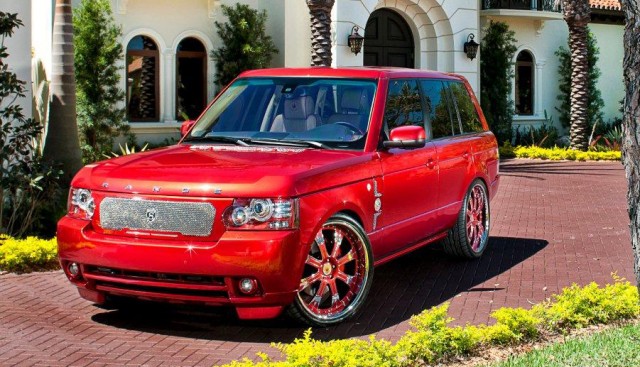 MC Customs in Miami built King Felix of the Seattle Mariners another car. There is no doubt about it, this one is a perfect 10. There are so many little details that went into this build, it is really a rare perfect build.  The best part about this Range Rover is the custom built 24″ wheels. These wheels are truly custom. Each one of the 8 spokes has a chrome crown designed into it and each wheel says King Felix on it. The center caps are also customized with his crown logo and they are floating caps! I love the way they painted red inside of the head lights. The chrome strut grille really makes up for the lack of chrome moldings and flows well with the chrome on the wheels. The interior is completely custom with the King Felix Crown stitched into the headrests. It also has a top of the line sound system to put it all together.  Superstar athelets take notes, this is how it is done. Find the best custom shop in your city, drop off the keys and leave them a blank check and let them do what they do best. [via celebritycarz.com]