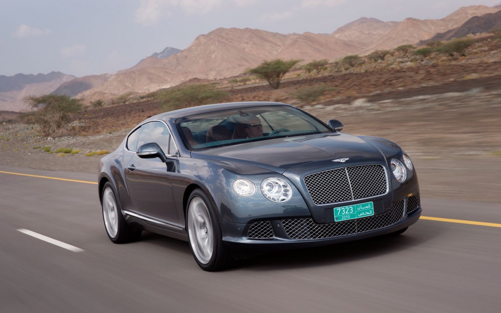 The Continental GT was introduced in 2003 and, due to its extreme success, marked the first major step in Bentley’s resurgence after its split with Rolls-Royce. For the 2011 Continental GT, Bentley hopes to build on its success by revising instead of remolding its form.  A more sculpted body gives the GT coupe a sharper and less bulbous appearance. The GT coupe’s grille is more upright and new headlamps offer jewel-like detailing with LED lights. At the rear, Bentley’s “floating” LED lamps now extend around the corners. Aluminium Super Forming technology uses a single sheet of aluminum for some parts of the car’s exterior. This process heats the aluminum panel to nearly 932 degrees Fahrenheit before shaping it with air pressure. Partly due to this process, the power lines and rear haunches are now sharper. A new trunk design also now features a powerful “double horse-shoe,” much like the Mulsanne. The new GT is also more aerodynamic with a coefficient of drag that has been reduced to 0.33 Cd and the lift at the axles has been reduced to create greater stability at higher speeds.  Overall, the GT coupe is 143 pounds lighter thanks to reductions in many areas. The result is a marked improvement in the GT’s power-to-weight ratio.